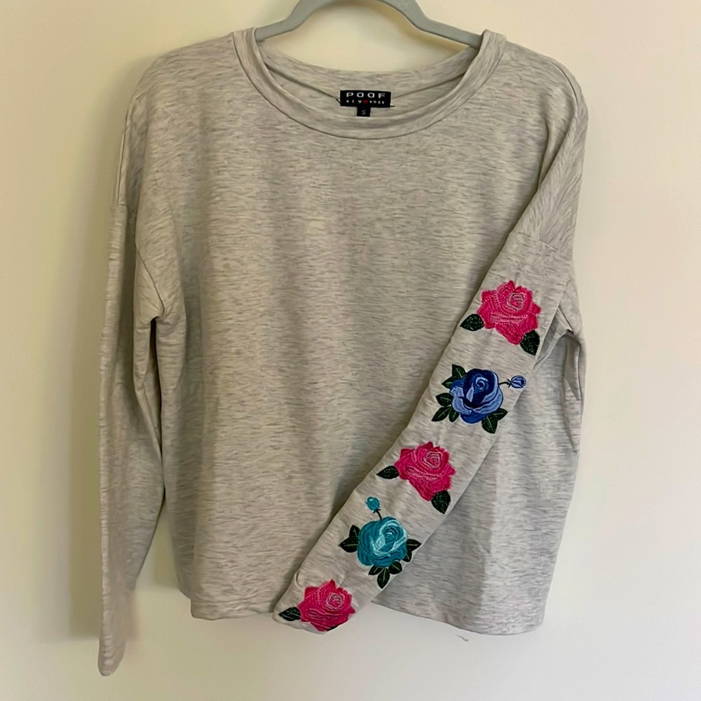 Size small light gray long sleeve shirt with 5 flower decal on left sleeve